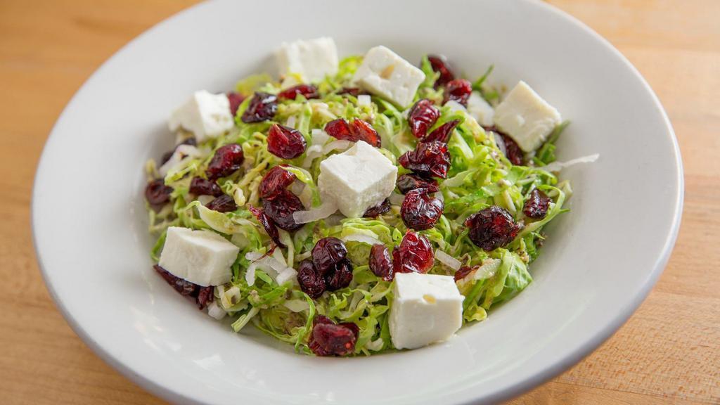 Brussels Sprout Salad · Shredded fresh Brussels sprouts, dried cranberries, feta cheese, shallots, house-made red wine vinaigrette.