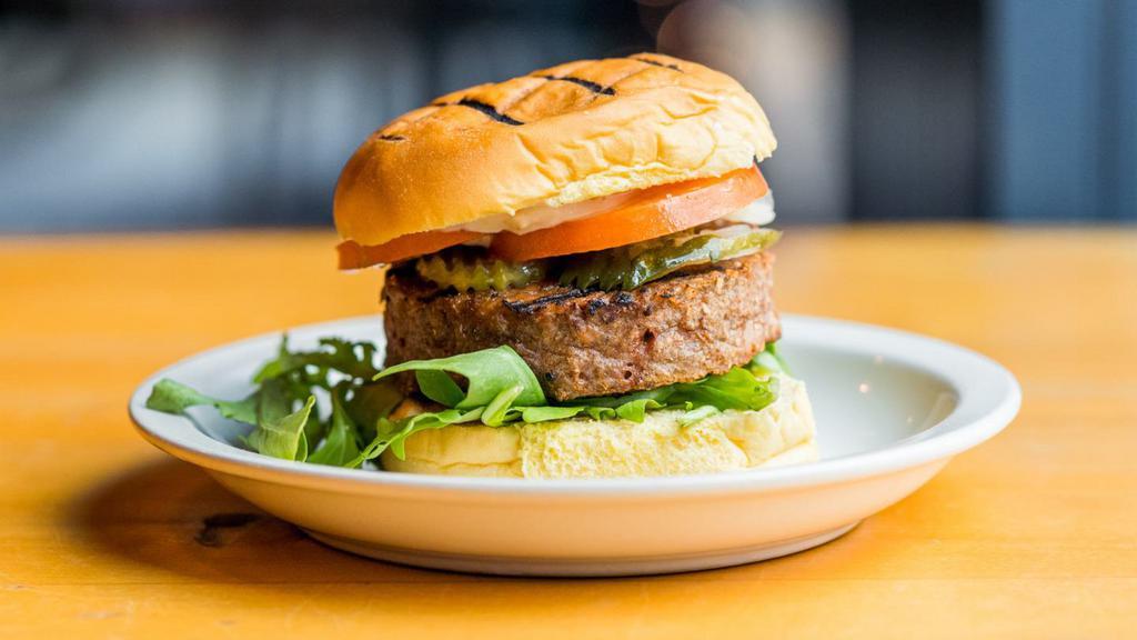Beyond Burger · Plant based burger, seared onions, bibb lettuce, tomato, pickles, special sauce on a potato bun.