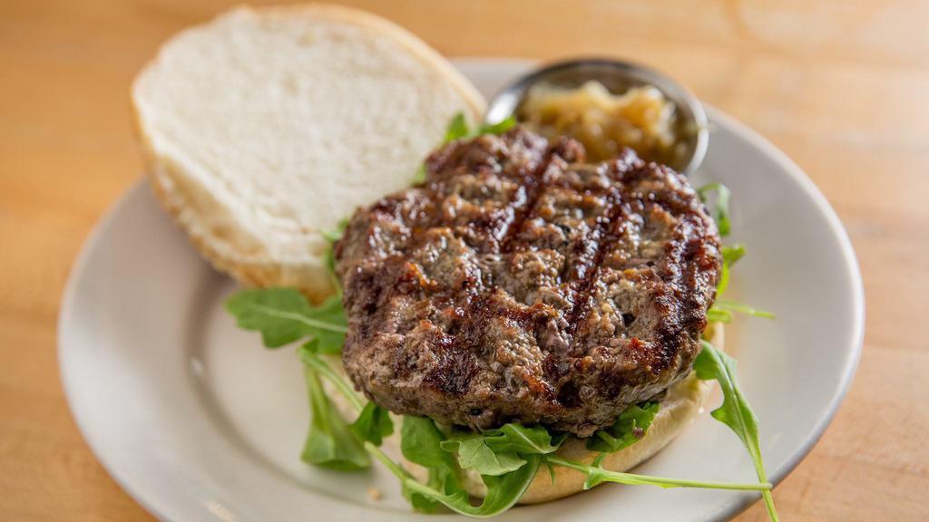 Highline Hanger Burger · Hanger steak blend patty, caramelized onions, arugula on a toasted sesame bun.