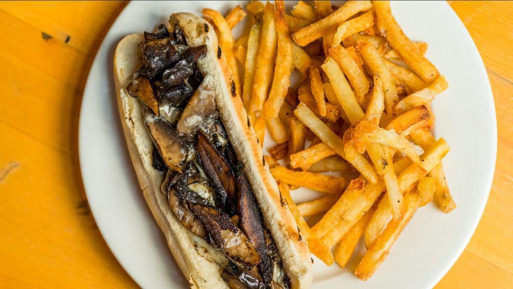 Veggie Cheesesteak · Sauteed Portobello Mushrooms & Onions, melted American cheese on a toasted hoagie roll. Served with fries