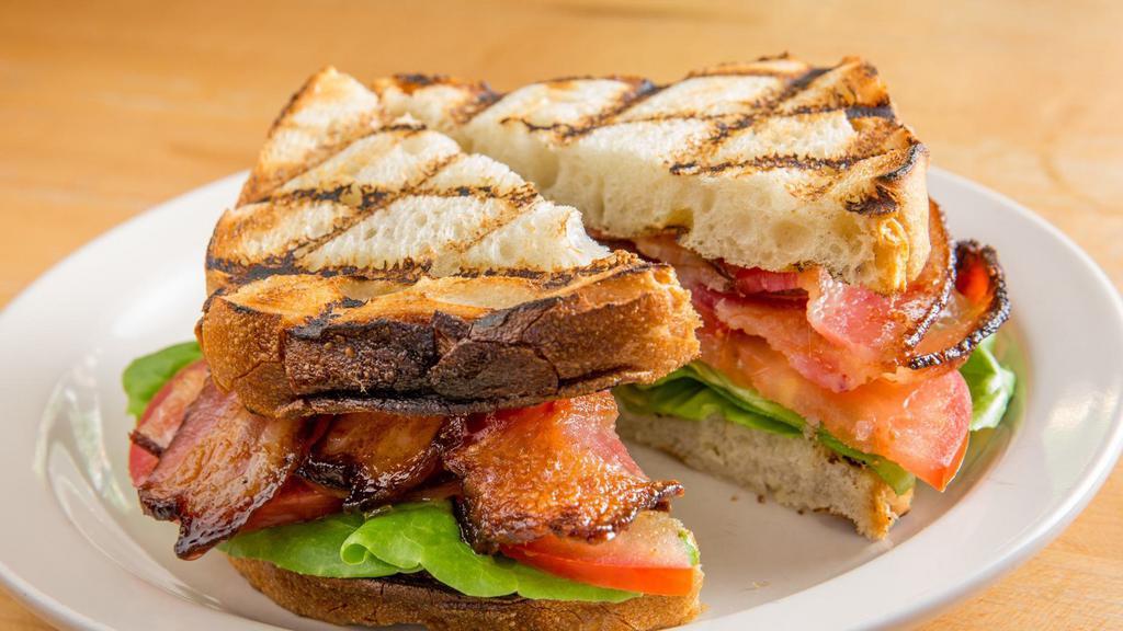 Blt · Applewood smoked bacon, lettuce, tomato, special sauce, on blue ribbon pullman bread.
