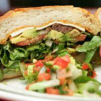 Grilled Steak Torta · Tomato, avocado, smashed beans, cheese, mayonnaise, and lettuce, chipotle or jalapeños.