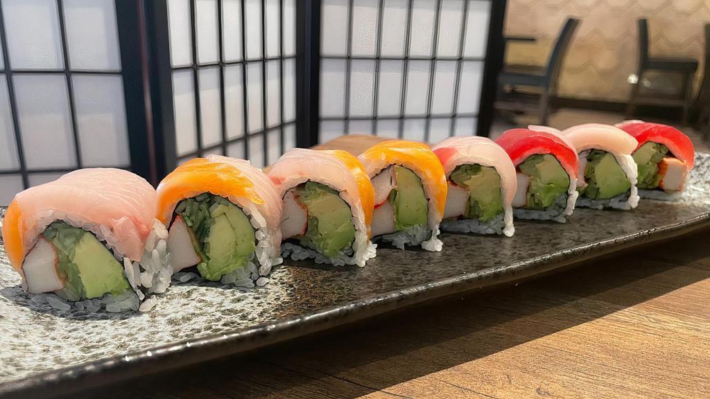 Rainbow Roll · Crab meat, cucumber, avocado inside. Topped with tuna, salmon, yellowtail and white fish.