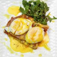 Oeufs Benedict · Cage free poached eggs, baked ham, hollandaise sauce on focaccia.