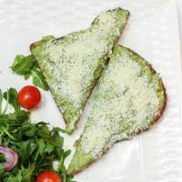 Toast A' L'Avocat · Freshly mashed avocado, goat cheese, parsley served with side salad.