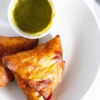 Vegetable Samosa · Crisp turnover filled with mildly spiced potatoes and peas.