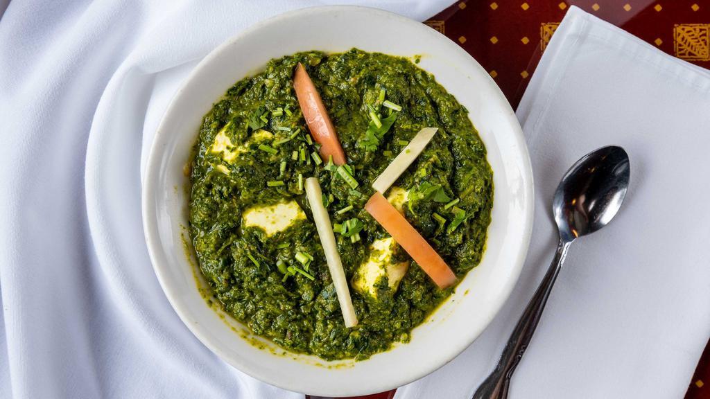 Saag Paneer · Spinach and homemade cheese cubes cooked in a mildly spiced sauce.