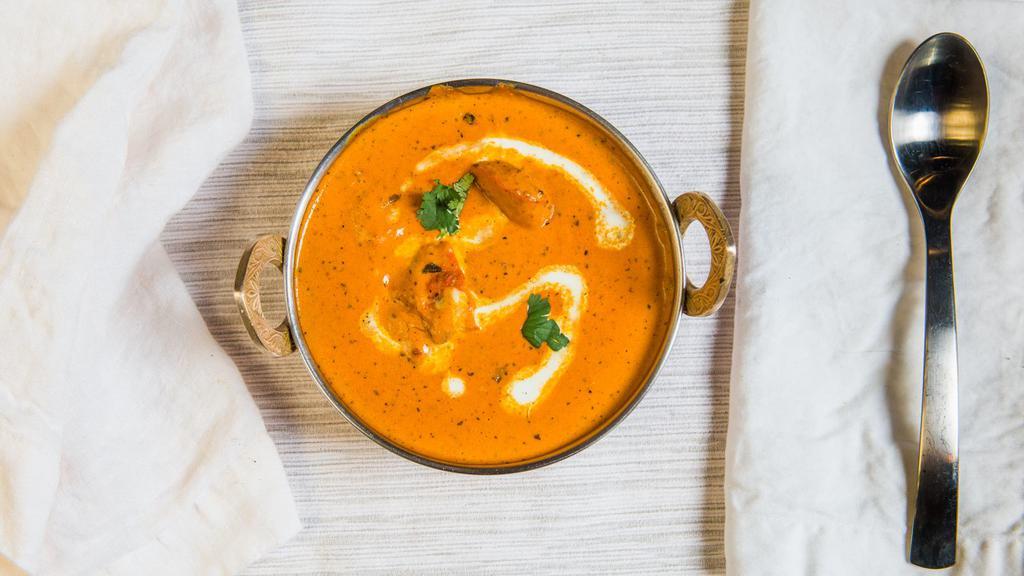 Chicken Tikka Masala · Boneless pieces of chicken tikka cooked in creamy butter sauce with fresh tomatoes and fragrant spices.