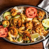 Shrimp Tandoori · Mild, large, mouth watering shrimp lightly seasoned and slowly broiled over charcoal in tand...