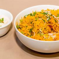 Chicken Biriyani · Chicken sautéed in herbs and spices with fragrant rice and nuts.
