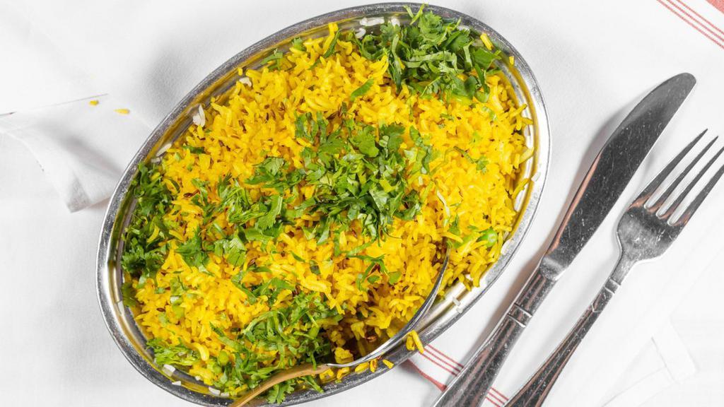 Vegetable Biriyani · Mixed vegetables sautéed in herbs and spices with fragrant rice and nuts.