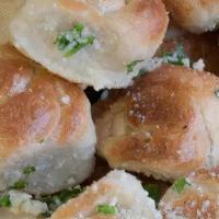 Garlic Knots · Six pieces of garlicky goodness. Real garlic, extra virgin olive oil, Parmesan cheese, and f...