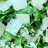 Arugula Salad With Shaved Parmesan · Shaved Parmesan over fresh baby arugula. Finished with a fresh extra virgin olive oil and le...