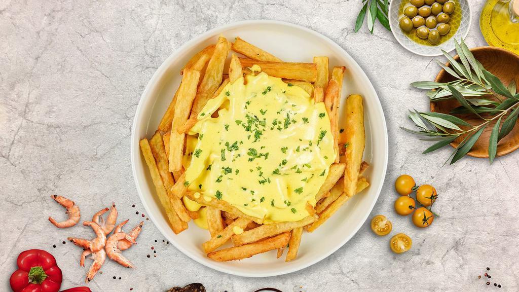Cheesy Melts Fries · Idaho potato fries cooked until golden brown and garnished with salt and melted cheddar cheese.