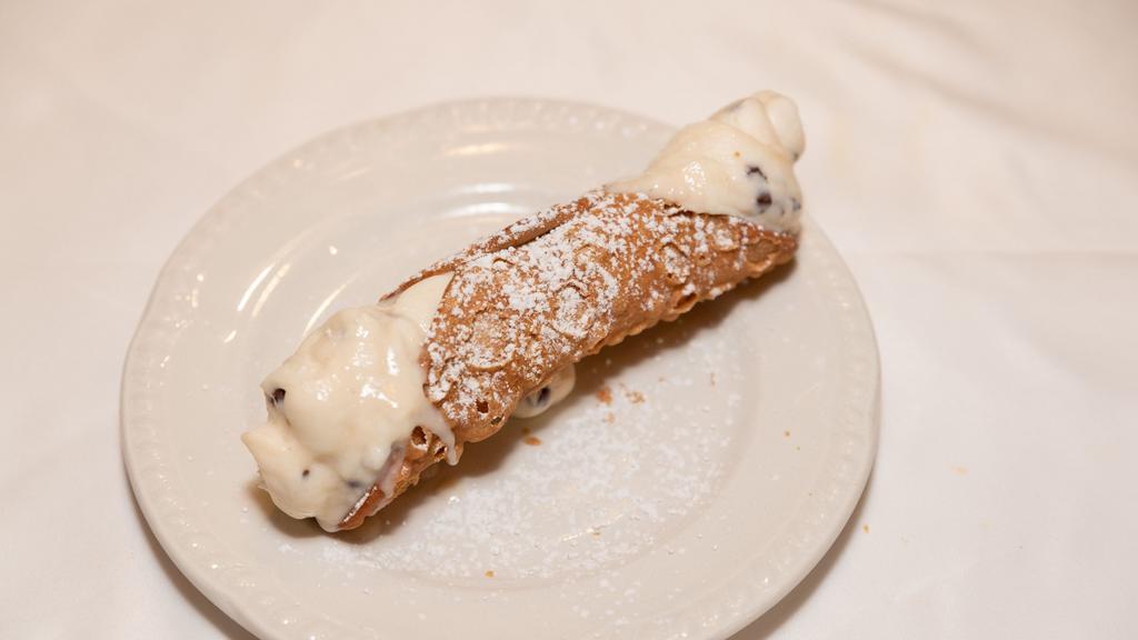 Cannoli · Jumbo pastry shell filled with creamy ricotta cheese and. chocolate chips.
