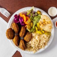 Falafel Platter · Vegetarian. Served with hummus, salad, rice, tzatziki, and hot sauce.