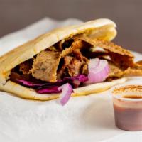 Lamb Gyro Naanwich · Lamb Gyro Served on a Homemade Naan bread topped with lettuce, cucumber, tomato, onion, and ...