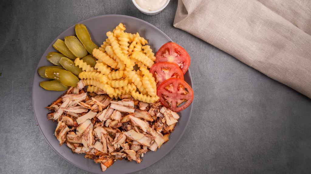 Chicken Shawarma · Juicy, thinly sliced, spit roasted chicken shawarma seasoned to perfection. Served with pickles, garlic sauce, fresh lettuce and tomatoes.