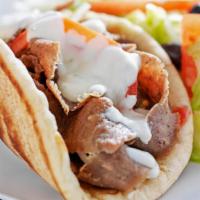 Combo Chicken And Lamb On Pita · Juicy lamb gyro and grilled chicken slices with your choice of toppings on a fresh baked pit...