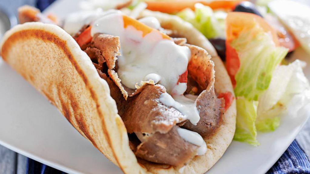 Combo Chicken And Lamb On Pita · Juicy lamb gyro and grilled chicken slices with your choice of toppings on a fresh baked pita bread.