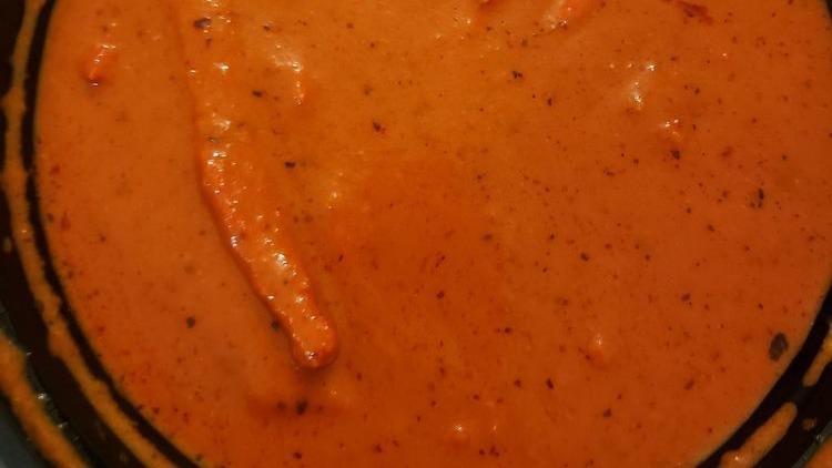 Butter Chicken · Chicken simmered in a tomato and buttery sauce.