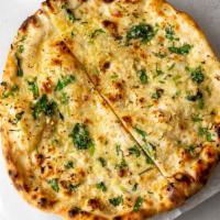 Garlic Naan · Freshly baked white bread topped with fresh garlic and butter.