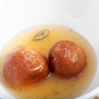 Gulab Jamun · Dumpling of milk reduced to semi-solid texture, dipped in saffron sugar syrup.