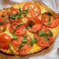 Herb Tomato · Fresh tomatoes w/ herbs, raclette cheese topped w/ balsamic fig glaze