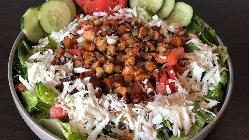 Roasted Candied Sweet Potato Salad · Lettuce, cucumber, tomatoes, shredded feta cheese, roasted candied sweet potatoes, warm nuts and seeds sauteed in chili sauce.