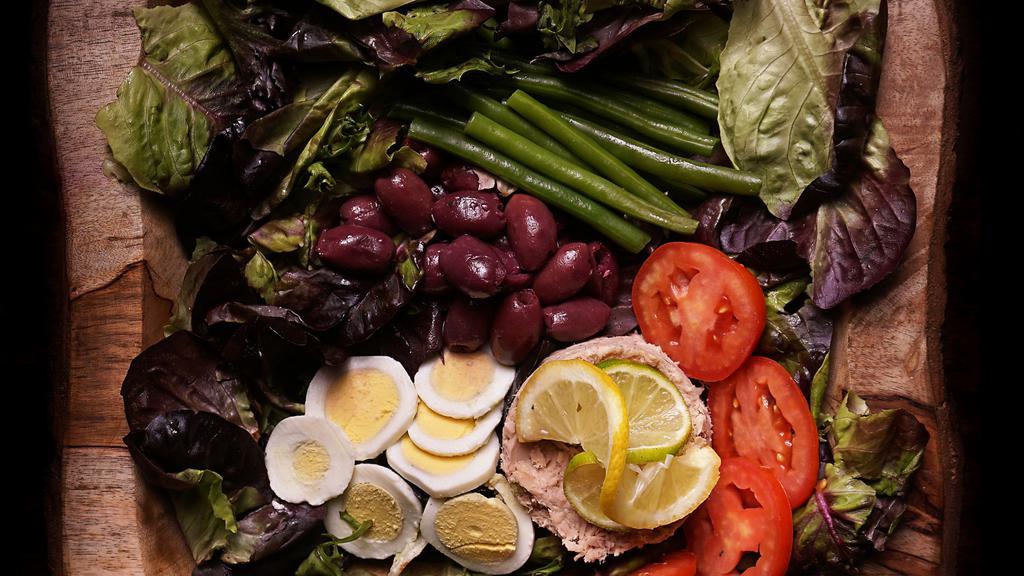 Tuna Nicoise Salad · Citrus tuna salad, tomatoes, garlic, anchovies, haricot-vert, hard boiled eggs, and citrus vinaigrette.