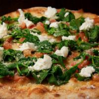 Bianca Pizza · Spinach, roasted garlic, ricotta, mozzarella, parmigiano, and fresh tomato.