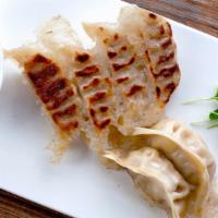Chicken Gyoza · Pan-fried or steamed dumplings with special garlic sauce.