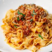 Fettuccine Bolognese · with classic pork & beef bolognese and parmigiano.