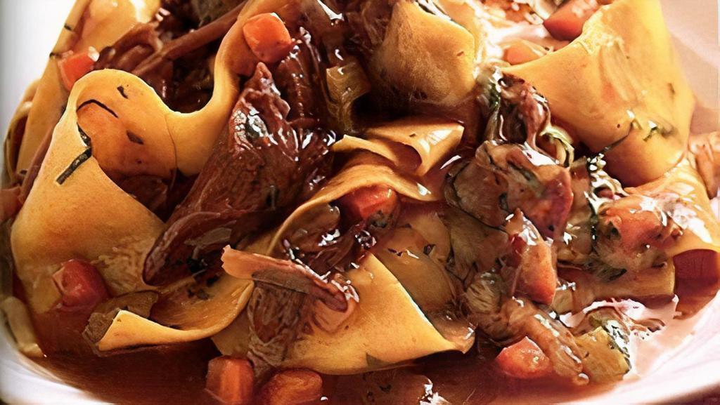 Pappardelle · with rosemary, slow-veal shank ragout, wild mushrooms and pecorino Crotonese