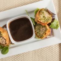 Italian Eggrolls · Fried eggrolls with sausage and broccoli rabe served with a side of garlic demy sauce.