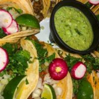 American Tacos · Cilantro, onions, lettuce, tomato, sour cream, cheese.