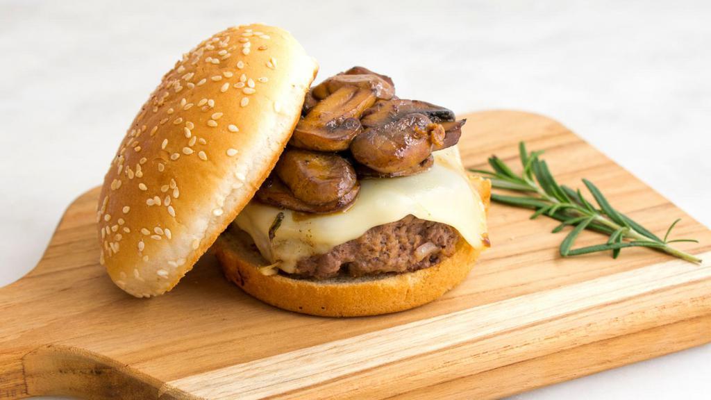 Mushroom Swiss Burger · Juicy beef patty, melted Swiss cheese, sautéed mushrooms, and onions.