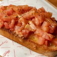 Bruschetta - Regular Price · Diced tomatoes on a toasted slice of bread drizzled with olive oil, salt and oregano