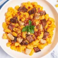 Meat Lovers Mac · For the meat lovers, traditional mac and cheese cooked with chicken, bacon, and steak to giv...