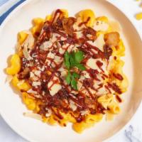 Bbq Chicken Dance Mac · Caramelized onions, BBQ cheese sauce, and roasted spicy chicken cooked with a blend of cream...