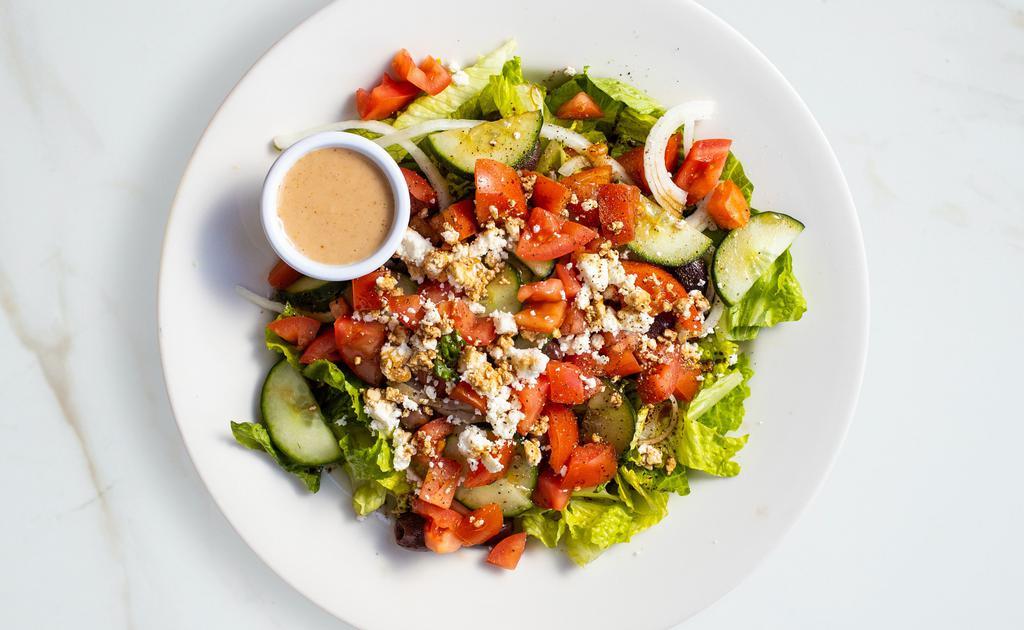 Greek Salad · Romaine lettuce with English cucumbers, red onions, kalamata olives, cherry tomatoes, feta cheese and mustard vinaigrette.