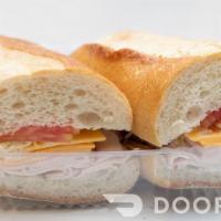 Turkey And Cheese Half Sub · Oven roasted turkey with yellow American cheese, lettuce and tomato.