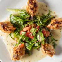 Crab Meat Stuffed Shrimp · With green spring mix.