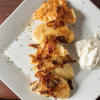 Perogies · With brown sugar and onions.