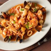 Seafood Stew · Fillet of sole, shrimp, calamari, mussels, garlic, plum tomatoes, an white wine sauce.