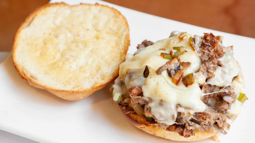Philly Cheese Steak Sandwich · Sauteed with peppers and onions on a hero.