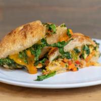 Veggie Panini · Red and green pepper, zucchini, red onion, carrot, spinach, Cheddar cheese (per request), ol...