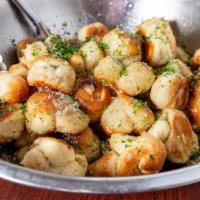 Garlic Knots (3 Pieces) · A classic snack, our garlic knots are strips of pizza dough tied in a knot, baked, and then ...