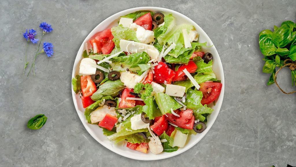 In The House Salad · Romaine lettuce, mixed baby greens, vine tomatoes, Bermuda onions, cucumbers, black olives, green and red peppers with Italian Dressing.