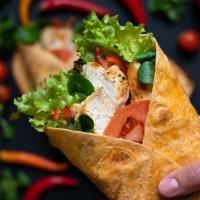 The Crunch Wrap · Corn tortilla filled with seasoned Beyond meat, melted vegan cheese, pico de gallo, avocado,...